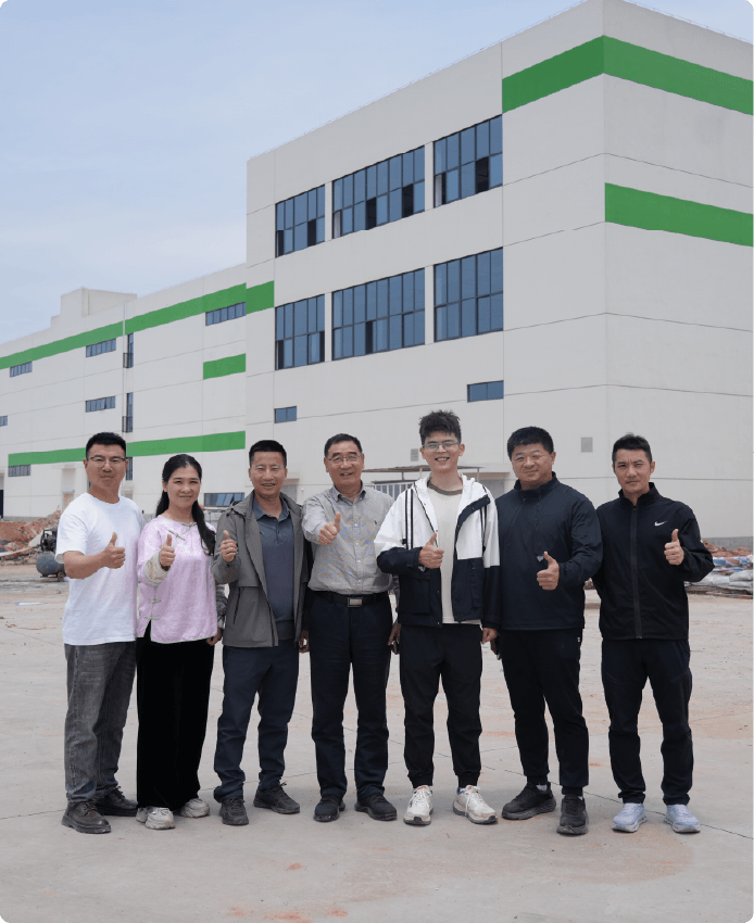 The Balance Master team standing in front of the workshop